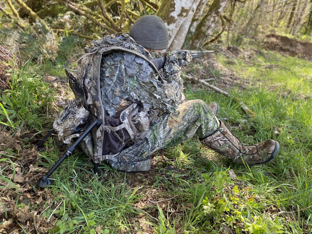 Author aims at the target with a rifle